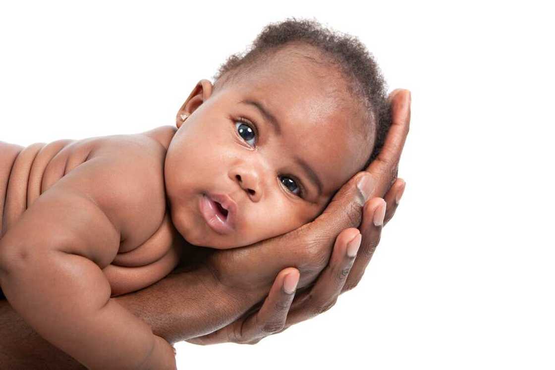 A baby in father's hands A baby in father's hands