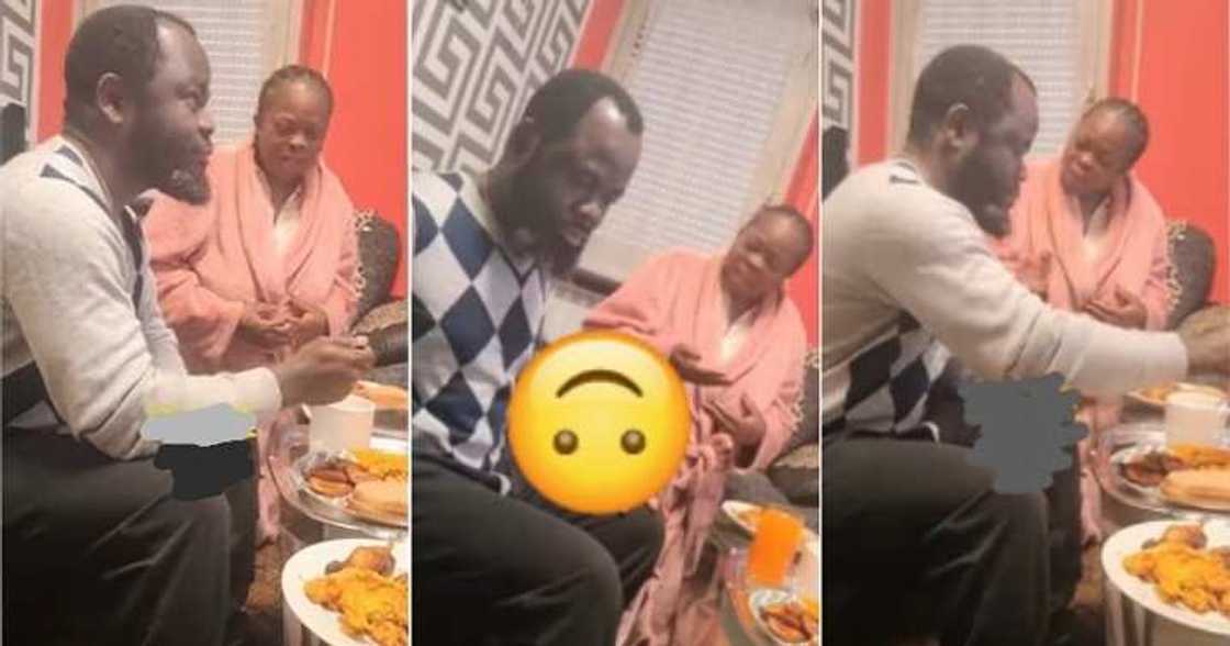 Woman kneels to serve food to husband Woman kneels to serve food to husband