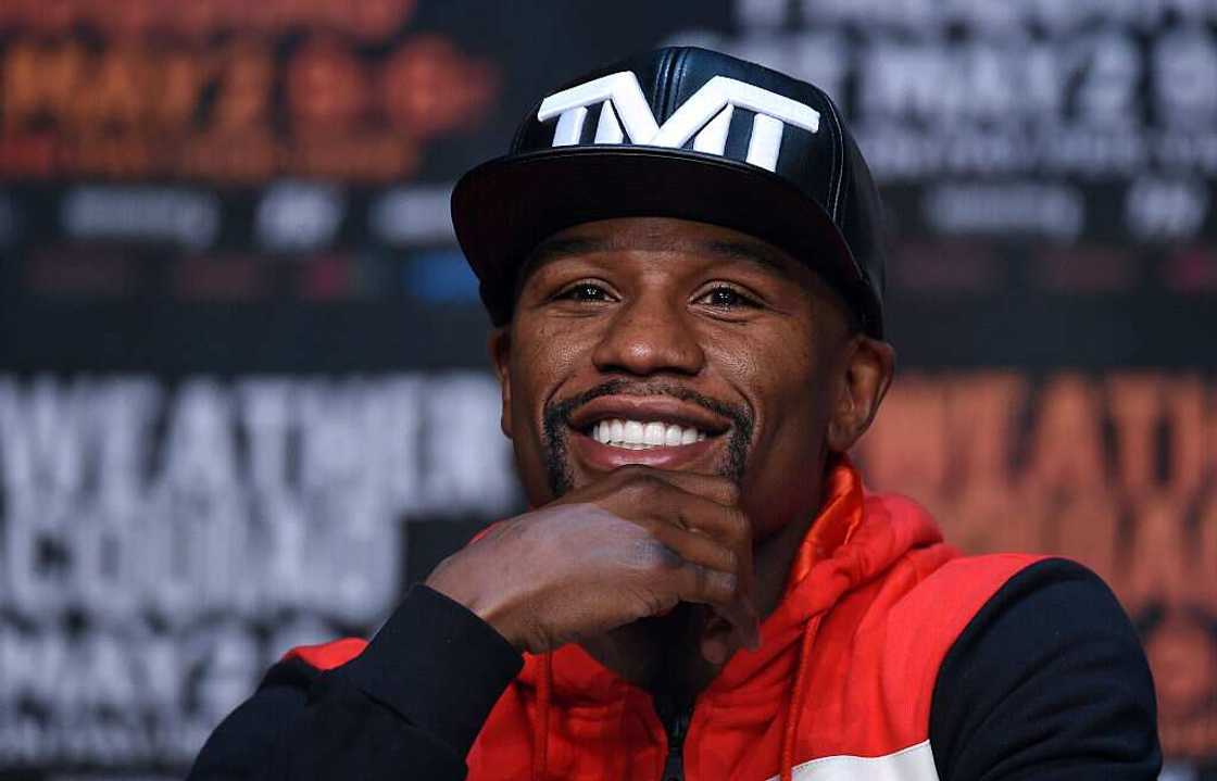 Floyd Mayweather Jr. smiles during a news conference at the KA Theatre
