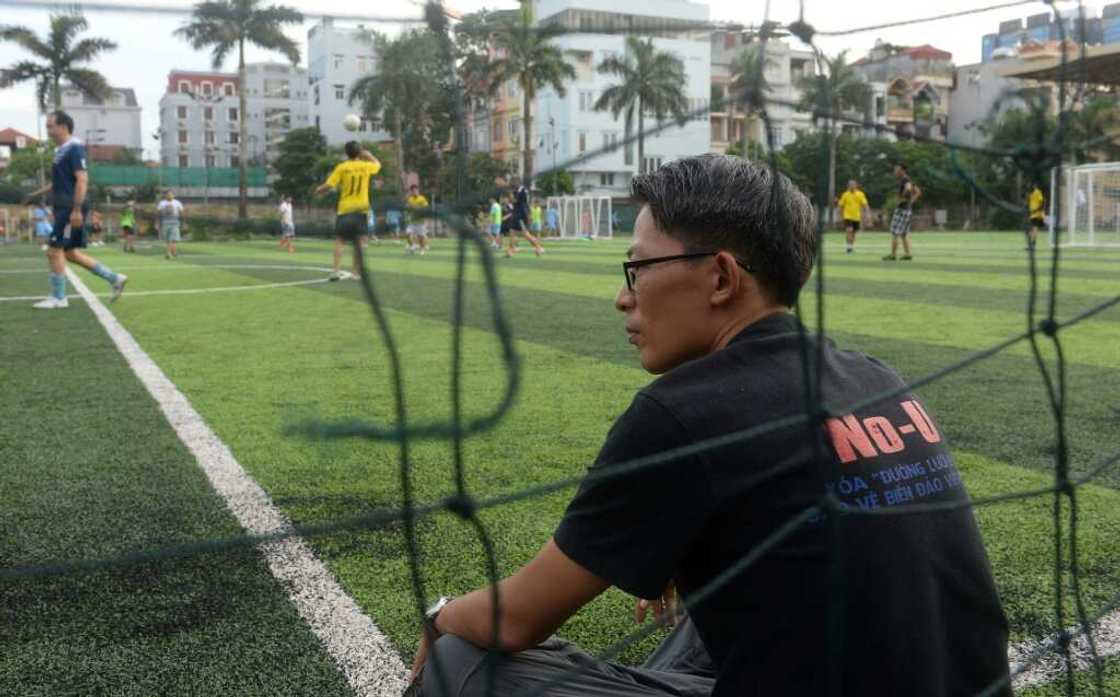 Rights activist Nguyen Lan Thang, pictured here at a football pitch in 2017, was arrested in Hanoi on Tuesday Rights activist Nguyen Lan Thang, pictured here at a football pitch in 2017, was arrested in Hanoi on Tuesday