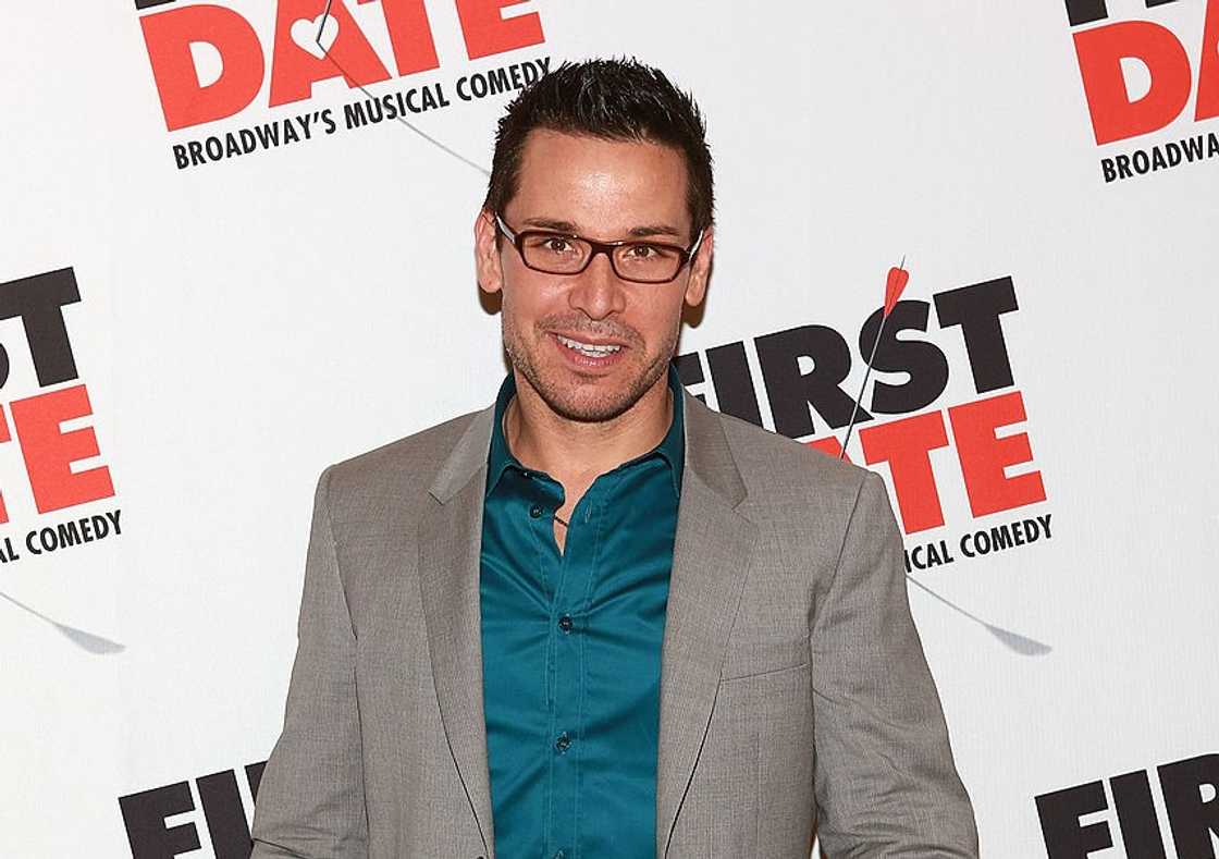 Kristoffer Cusick pose in a grey suit and a blue shirt at Gotham Hall Kristoffer Cusick pose in a grey suit and a blue shirt at Gotham Hall