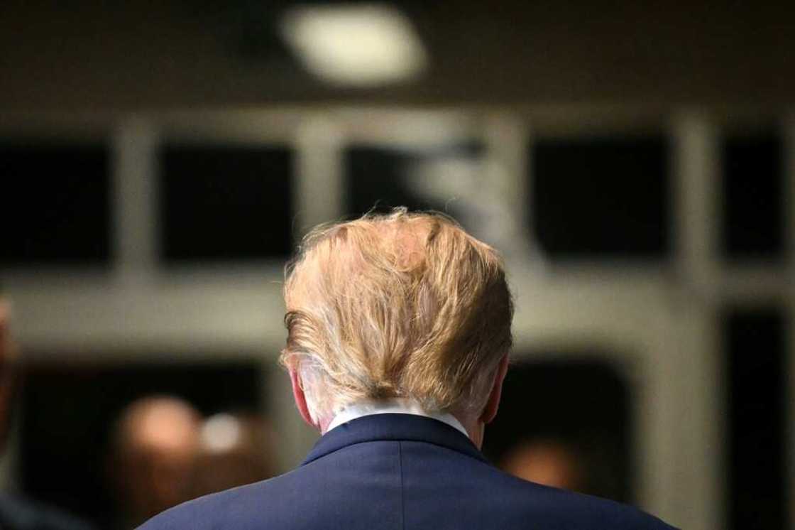 Former US President Donald Trump walks to the courtroom after speaking to the press at Manhattan Criminal Court in New York City on February 15, 2024