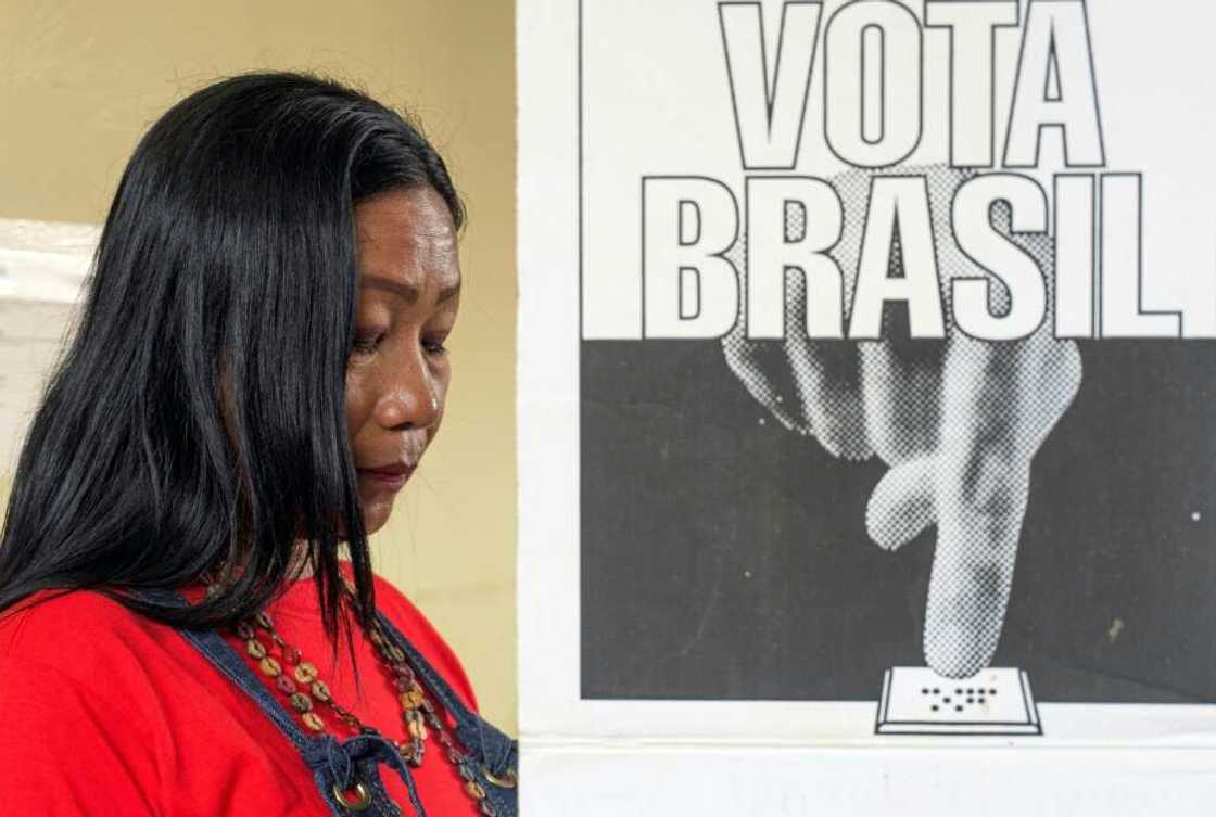 A Ticuna woman casts her ballot A Ticuna woman casts her ballot