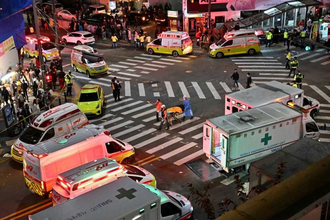 Authorities cordoned off a street where some 120 people were killed in a stampede in South Korea's capital Seoul Authorities cordoned off a street where some 120 people were killed in a stampede in South Korea's capital Seoul