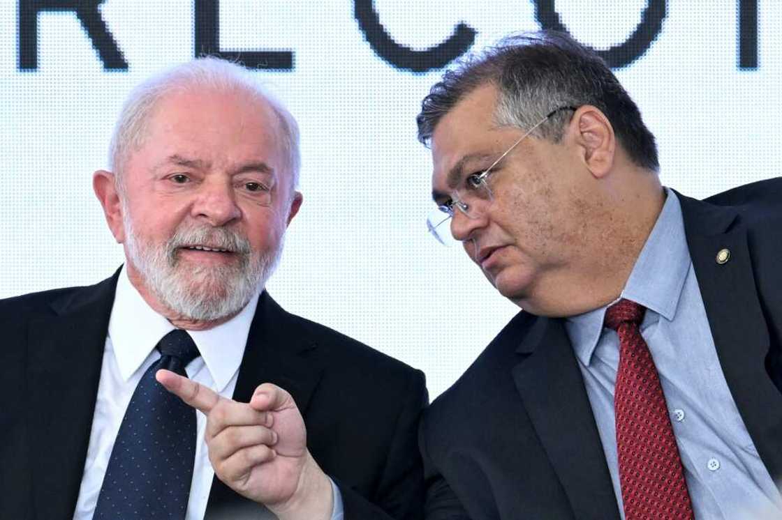 Brazilian President Luiz Inacio Lula da Silva (L) and Justice Minister Flavio Dino (R) Brazilian President Luiz Inacio Lula da Silva (L) and Justice Minister Flavio Dino (R)