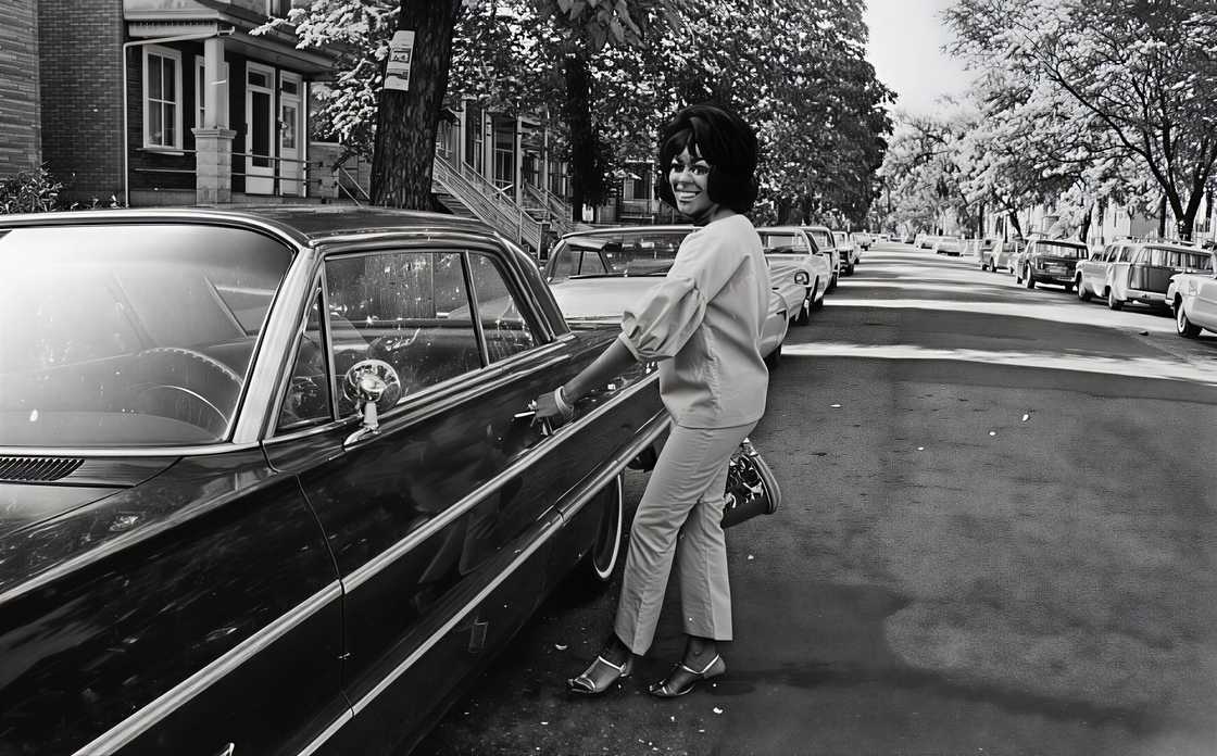 Sonji Clay holds her car door