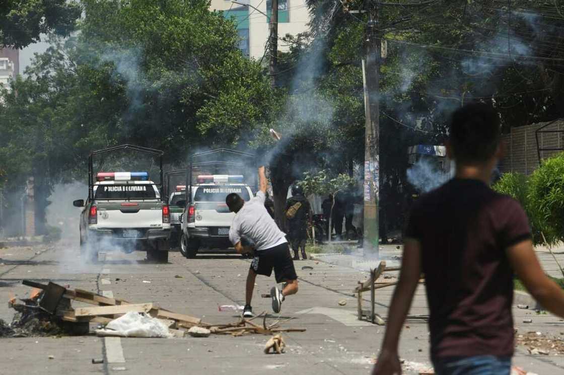 Protesters clash with riot police in the streets of Santa Cruz, Bolivia, on November 11, 2022 Protesters clash with riot police in the streets of Santa Cruz, Bolivia, on November 11, 2022