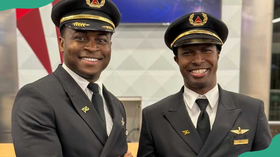 Two pilots smile as they pose for a photo Two pilots smile as they pose for a photo