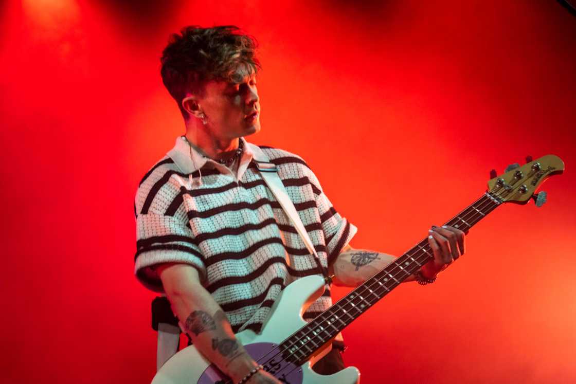 Connor Ball of The Vamps playing guiter at Fabrique Club Connor Ball of The Vamps playing guiter at Fabrique Club