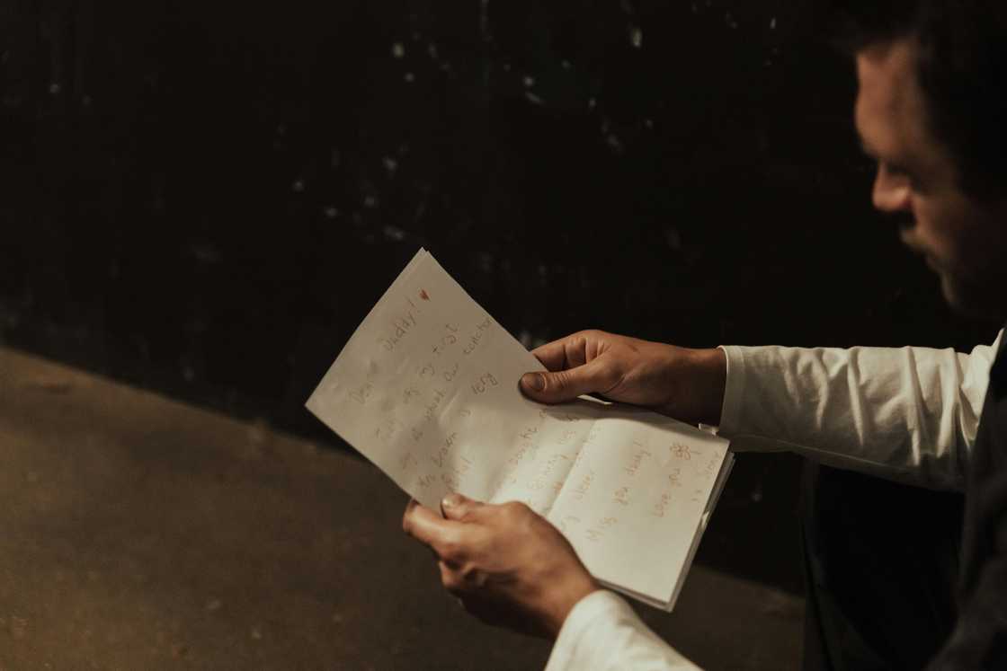 A man reading a note