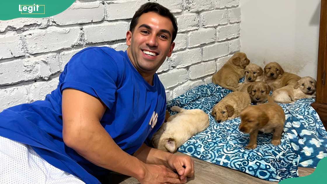 Shammi Prasad posing with his puppies.