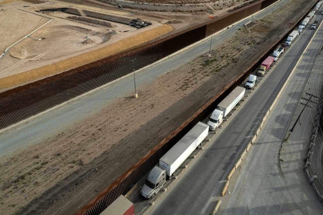 Trucks queue to enter the United States from Mexico