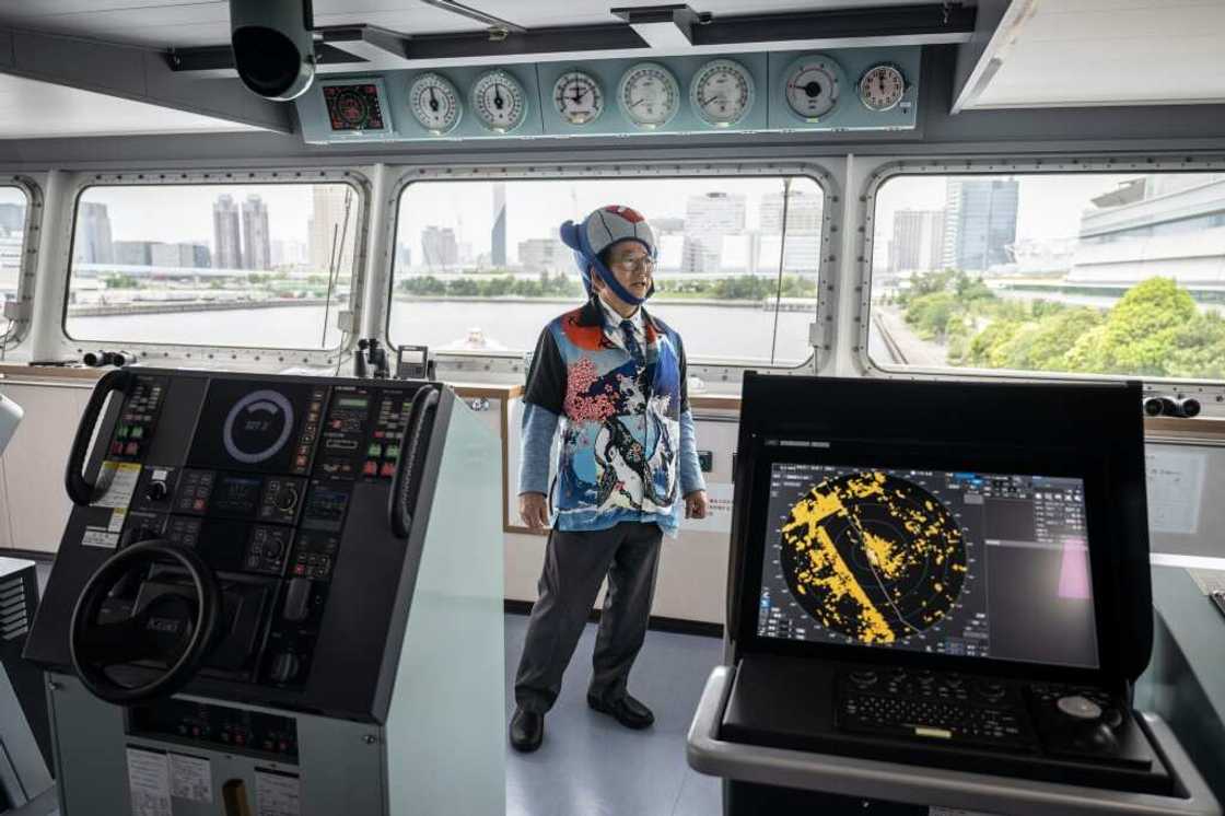 In whale-motif jacket, shirt and tie plus a whale-shaped hat, Hideki Tokoro shows off Japan's new whaling 'mothership' In whale-motif jacket, shirt and tie plus a whale-shaped hat, Hideki Tokoro shows off Japan's new whaling 'mothership'