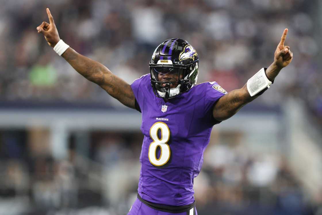 Lamar Jackson celebrates throwing a touchdown pass against the Dallas Cowboys Lamar Jackson celebrates throwing a touchdown pass against the Dallas Cowboys