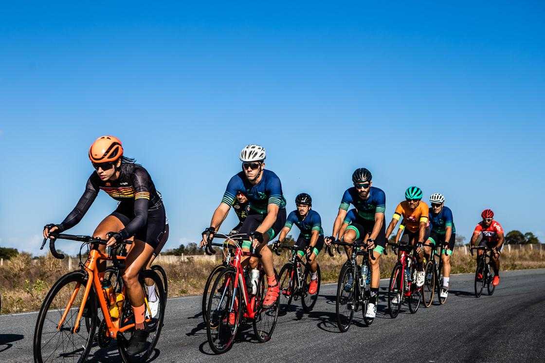 Cyclists riding bikes on road during a race