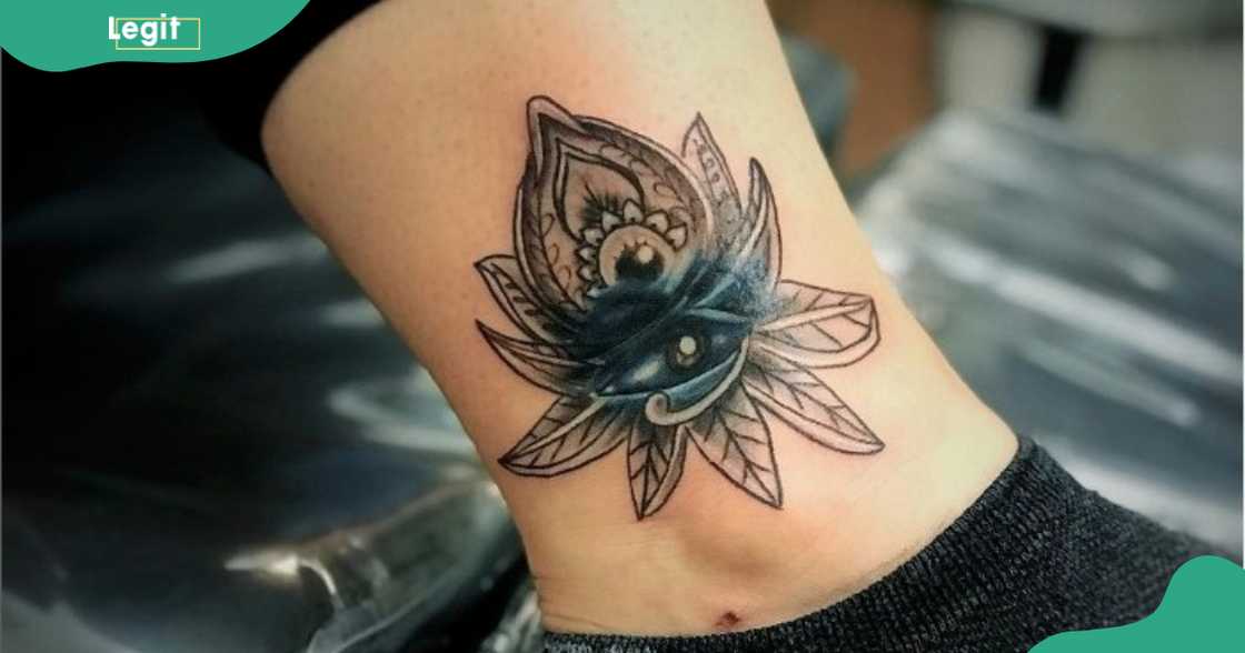An Eye of Horus tattoo with a lotus flower. An Eye of Horus tattoo with a lotus flower.
