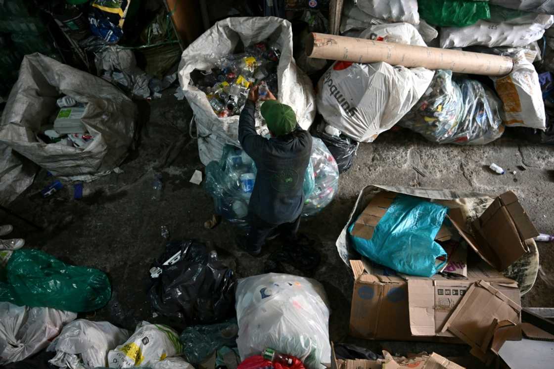 A recycler works at a recycling warehouse in Bogota: Colombian cities have no public recycling systems