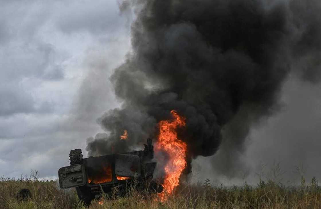A military vehicle burns outside of the Izyum, a city recaptured by Ukraine troops A military vehicle burns outside of the Izyum, a city recaptured by Ukraine troops