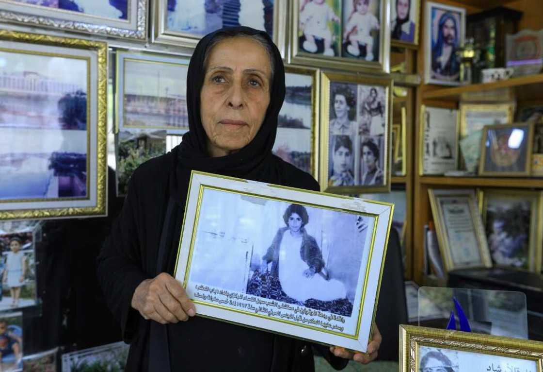 Photographer and ex-political prisoner Samira Mazaal, 77, poses with a framed picture of her on a hospital bed after being tortured Photographer and ex-political prisoner Samira Mazaal, 77, poses with a framed picture of her on a hospital bed after being tortured