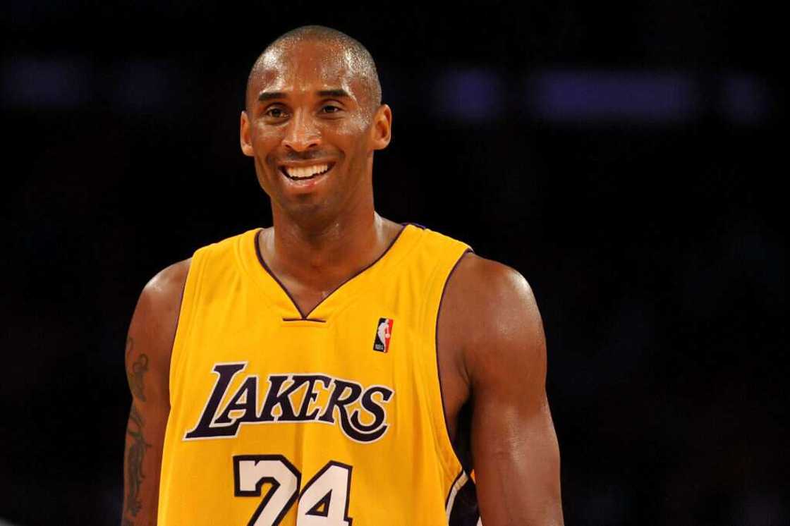 Kobe Bryant smiles in a Los Angeles Lakers jersey Kobe Bryant smiles in a Los Angeles Lakers jersey