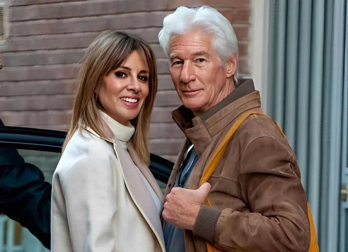 Richard Gere and Alejandra Silva pose standing