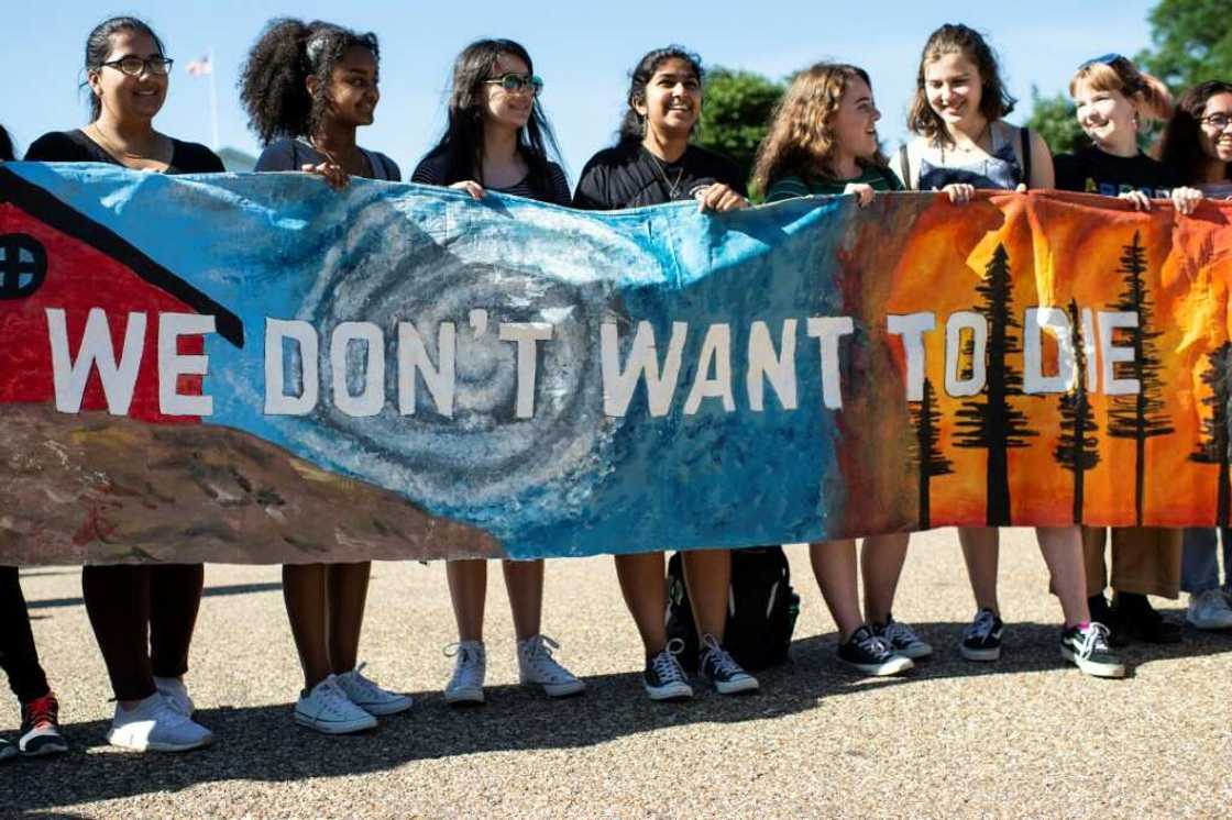 Young Americans protest outside the White House in Washington, DC during a "Fridays for Future" march in 2019 Young Americans protest outside the White House in Washington, DC during a "Fridays for Future" march in 2019