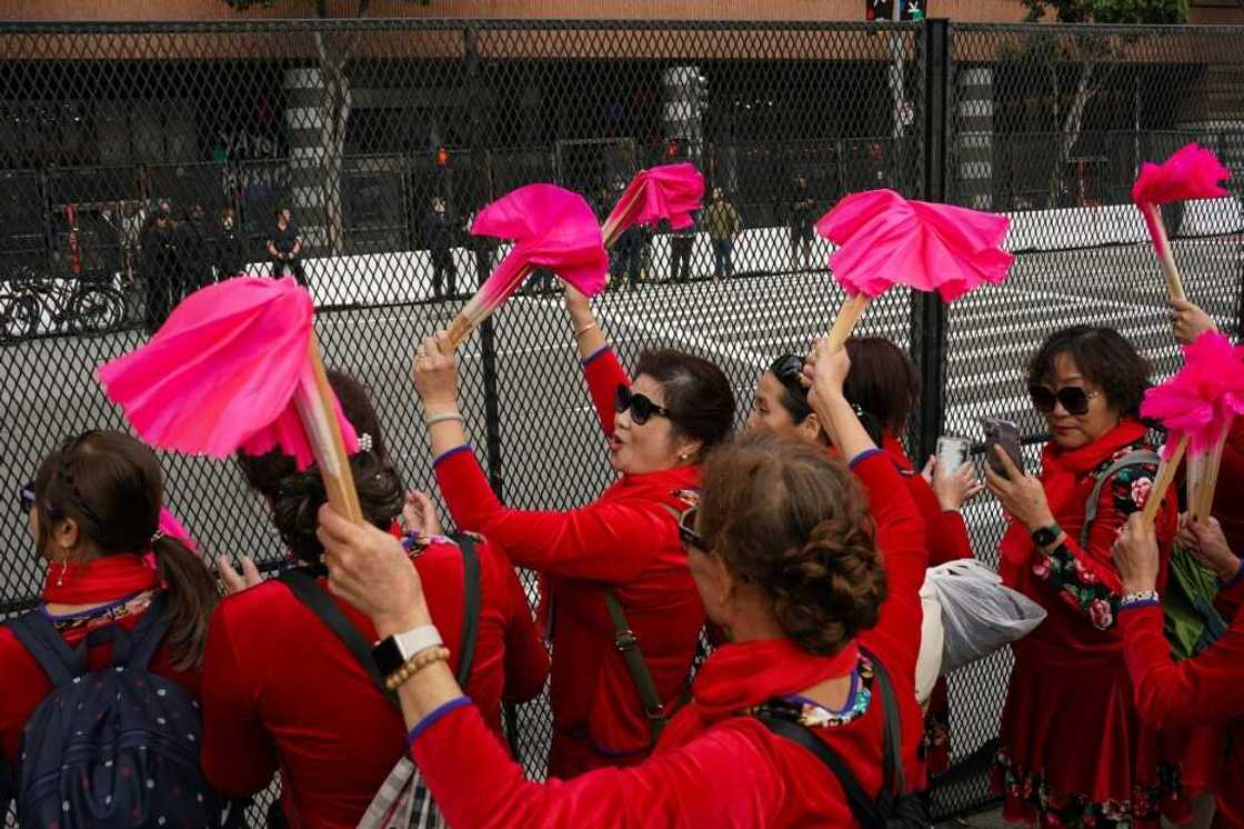 Supporters lined the streets to welcome Xi Jinping, as did protesters