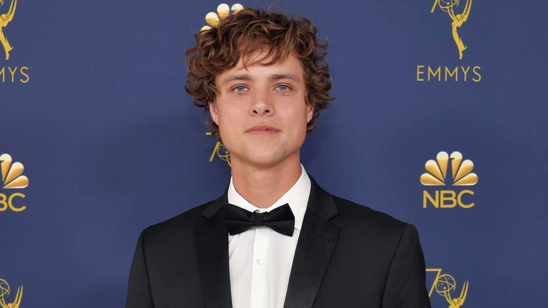 Douglas Smith poses on the red carpet of the 70th Emmy Awards at Microsoft Theatre in 2018 in Los Angeles, California. Douglas Smith poses on the red carpet of the 70th Emmy Awards at Microsoft Theatre in 2018 in Los Angeles, California.