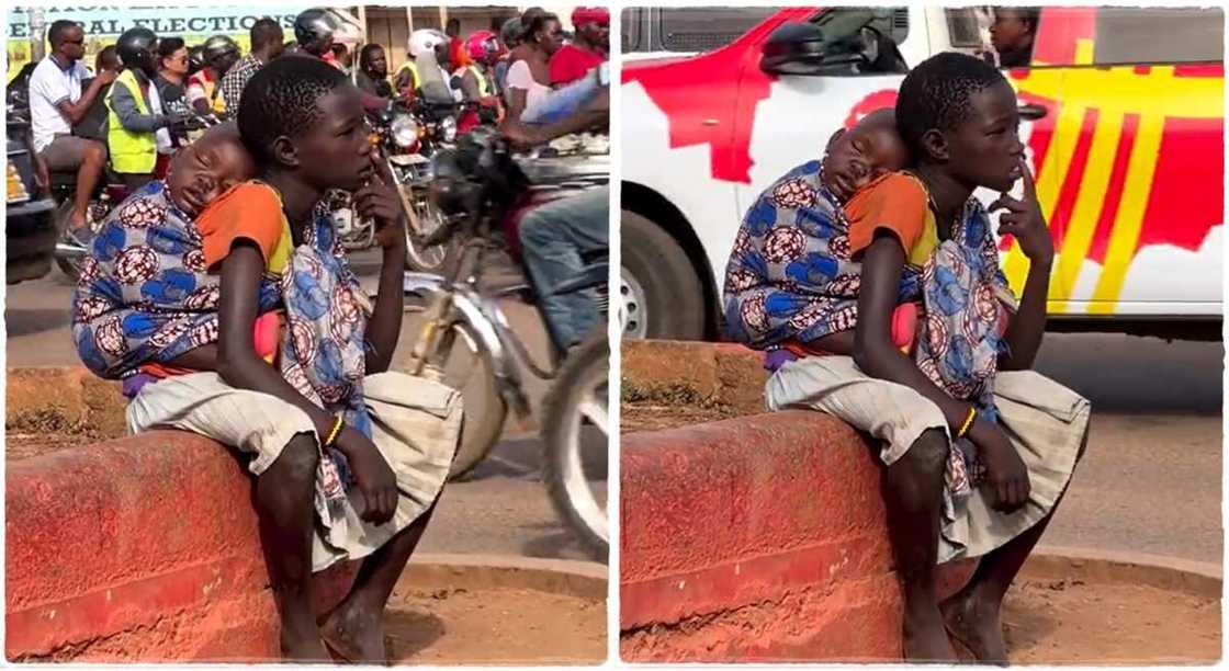 Photos of a girl sitting by the roadside with a baby on her back. Photos of a girl sitting by the roadside with a baby on her back.