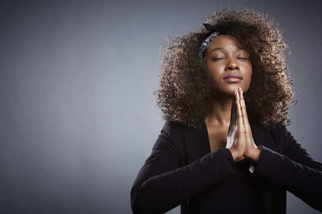 A woman is praying for quick recovery A woman is praying for quick recovery