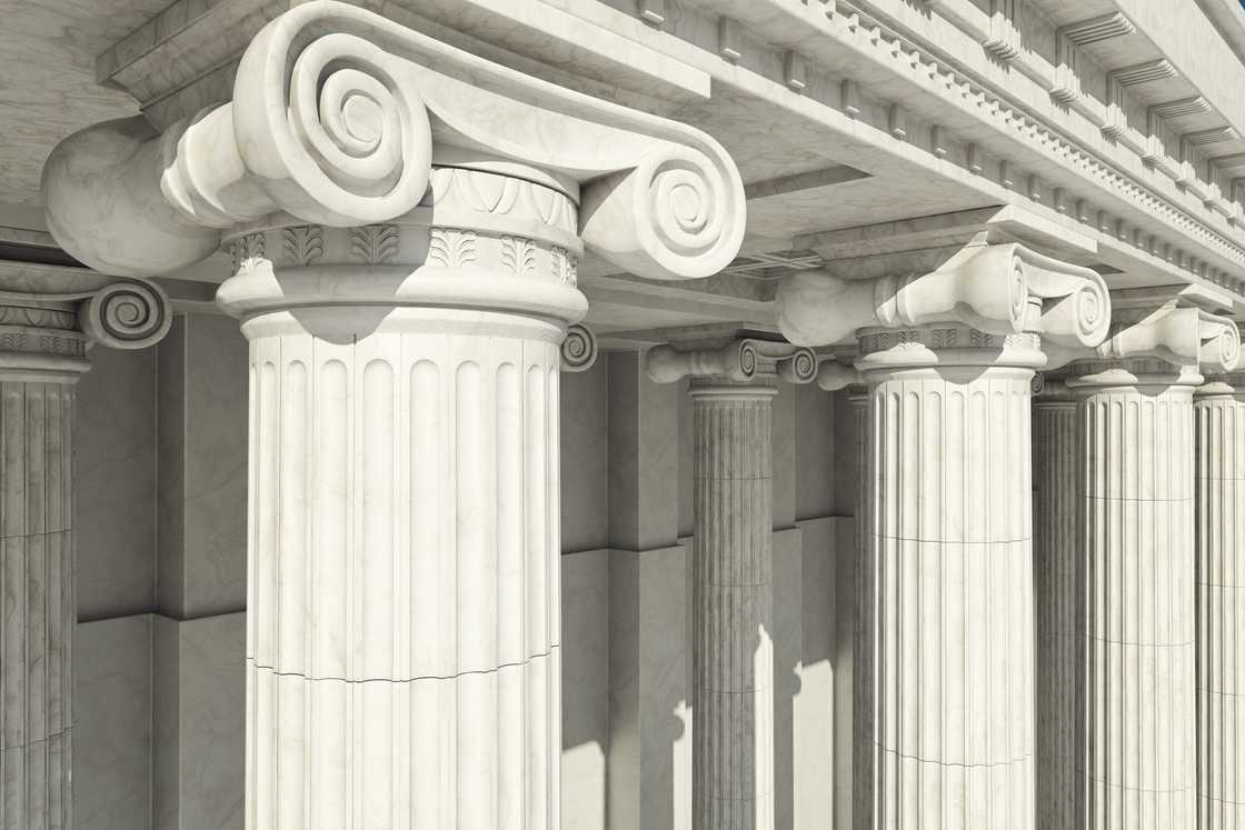 Close-up shot of a line of Greek-style columns. Close-up shot of a line of Greek-style columns.
