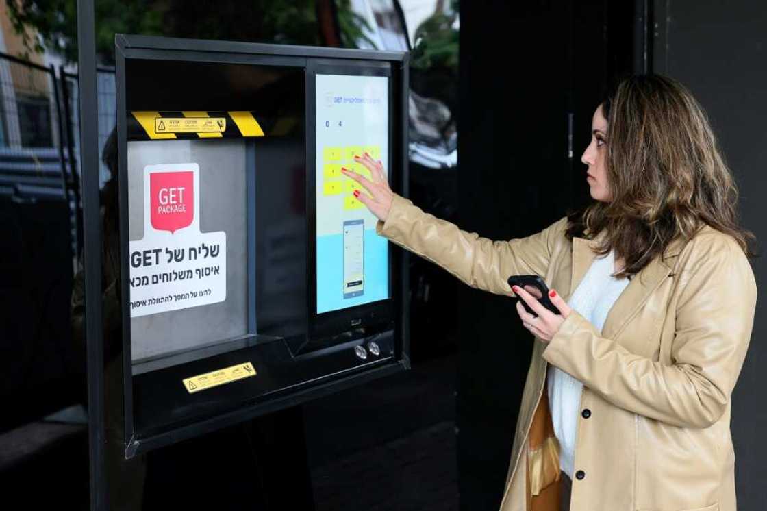 The robot toils in the custom-made space, fitted with a streetside hatch for couriers and shoppers to collect online orders