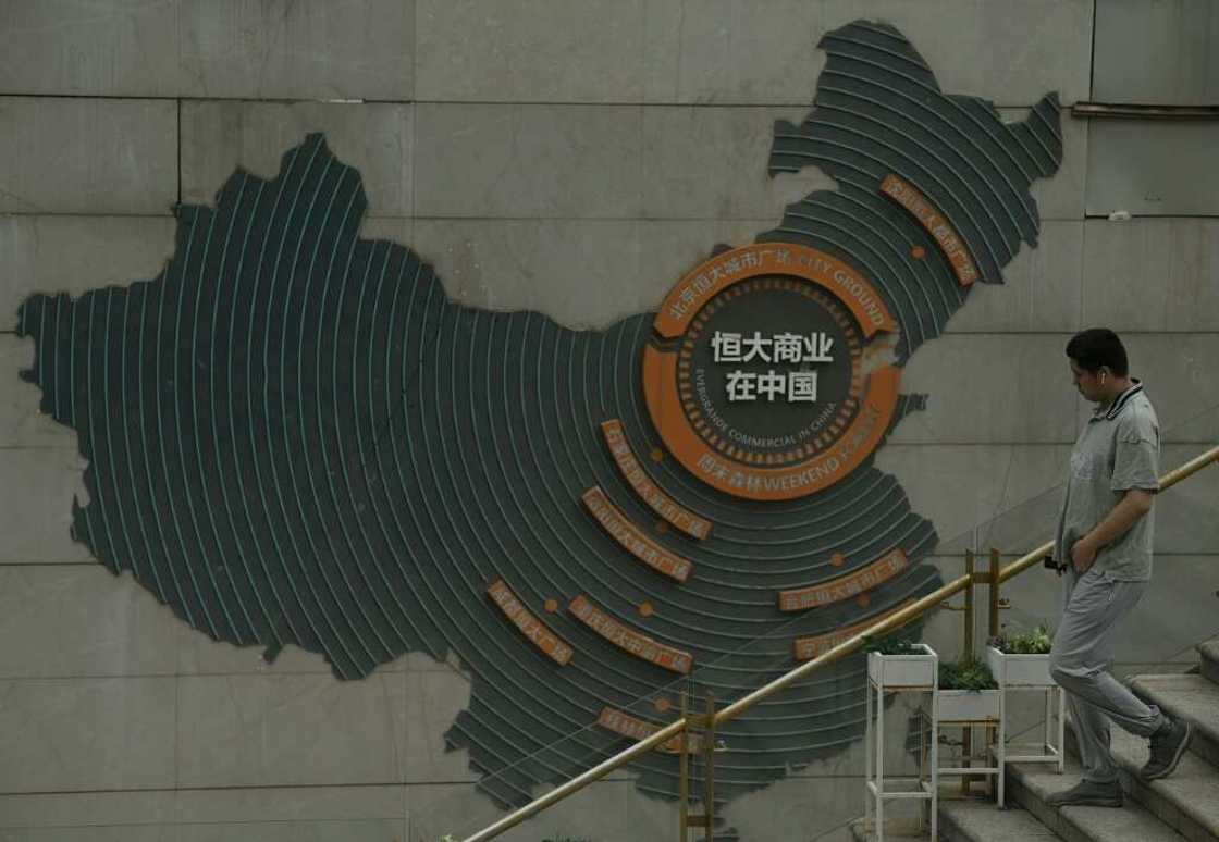 Evergrande is in restructuring talks as it struggles under a debt mountain of more than $300 billion Evergrande is in restructuring talks as it struggles under a debt mountain of more than $300 billion