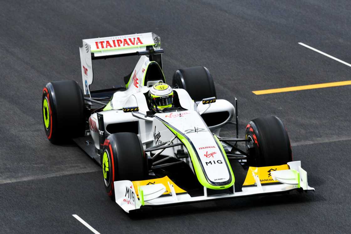 Jenson Button competes in a Brawn BGP001