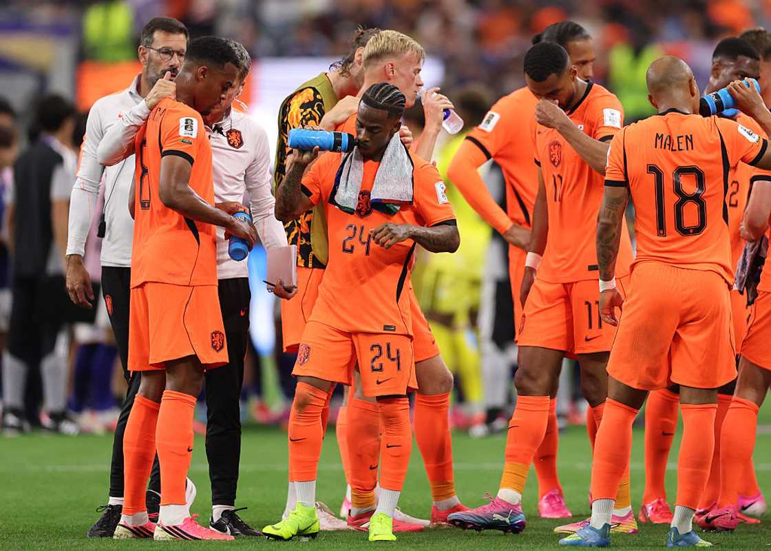 rysencio Summerville and his Netherlands teammates takes a drink during a hydration break