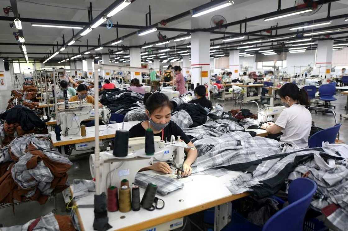 Vietnamese workers at a Hanoi factory which makes clothes for various brands Vietnamese workers at a Hanoi factory which makes clothes for various brands