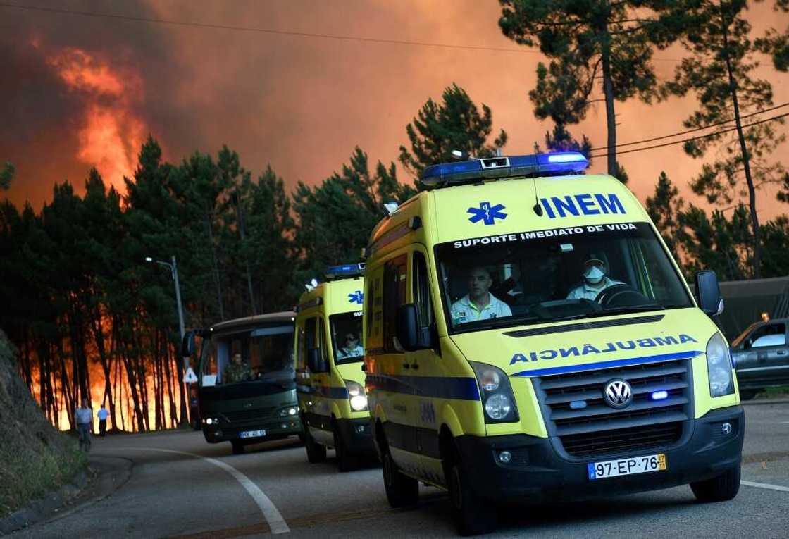 Ambulances evacuate people from Picha, a village in Pedrogao Grande district, in 2017