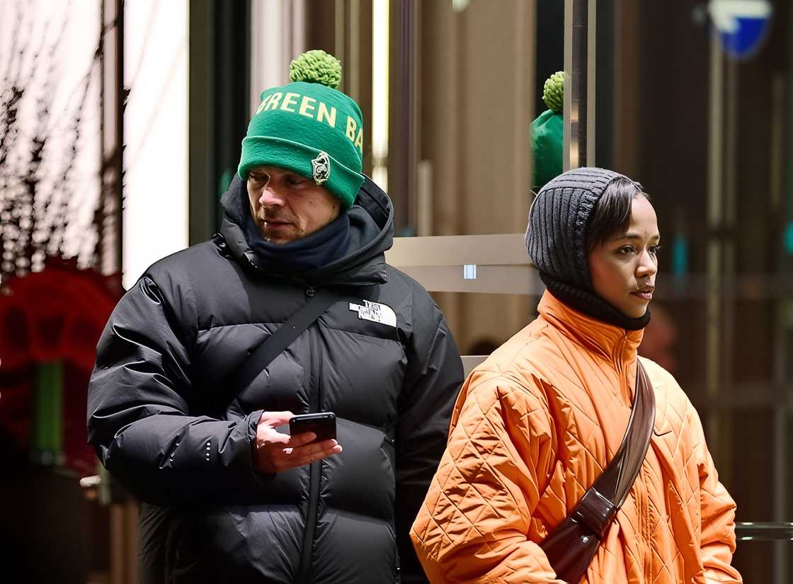 Harry Styles and Taylor Russell walking in London
