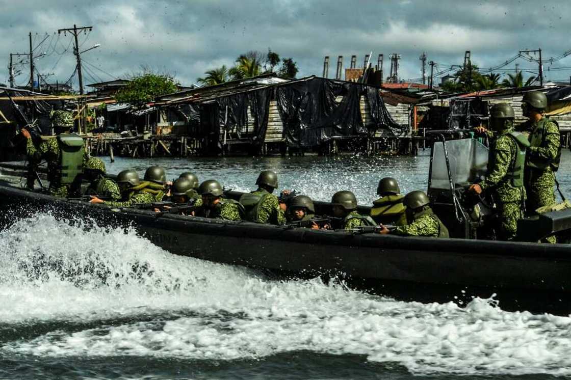 A Colombian navy patrol in the waters around Buenaventura, where rival gangs have turned the major port city into a living nightmare for residents A Colombian navy patrol in the waters around Buenaventura, where rival gangs have turned the major port city into a living nightmare for residents