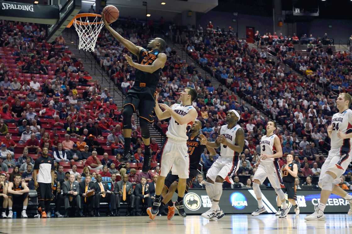 Markel Brown of the Oklahoma State men's basketball team jumps to dunk.