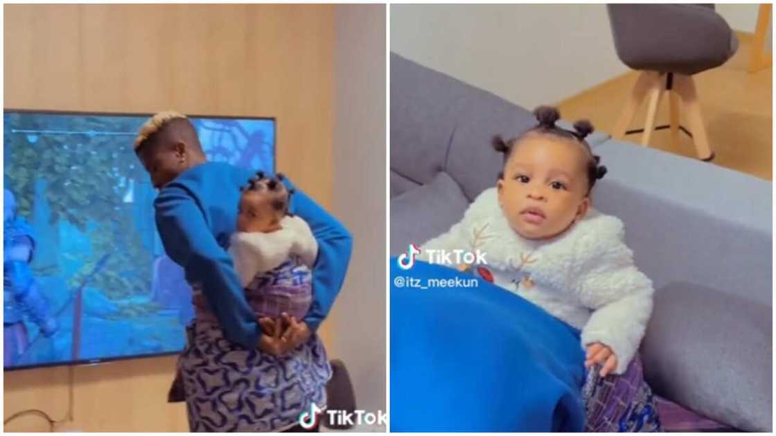P Olayinkaka backs his baby, dances in video. Photo Source:Tiktok/@itz_meekun P Olayinkaka backs his baby, dances in video. Photo Source:Tiktok/@itz_meekun