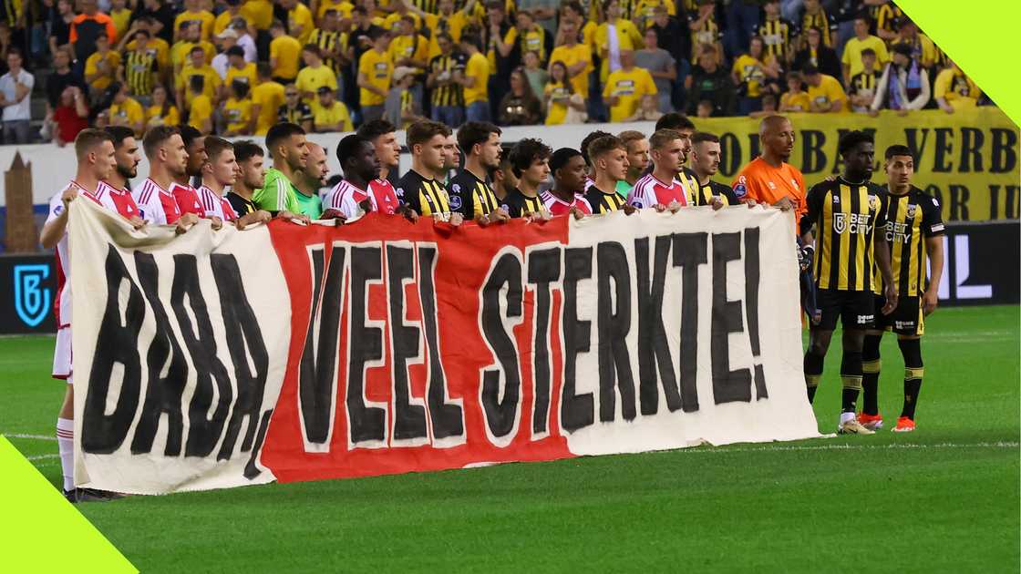 Ajax and Vitesse holds a banner in support of Tijani Babangida