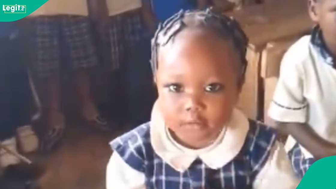 A brilliant little girl answers questions correctly in class. A brilliant little girl answers questions correctly in class.