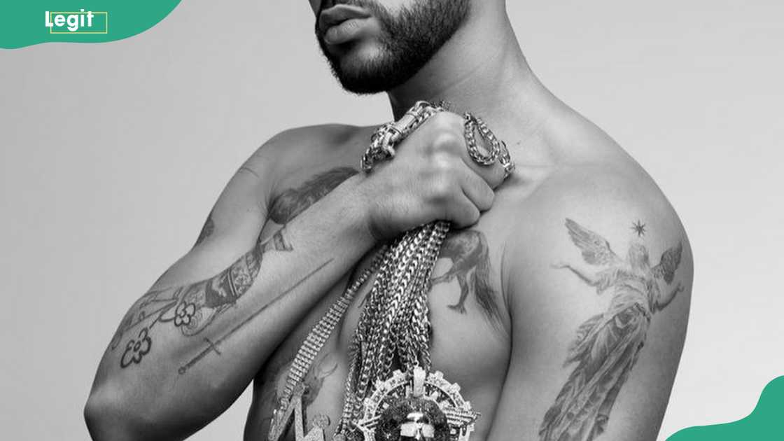 Bab Bunny's knight sword and angel tattoo Bab Bunny's knight sword and angel tattoo