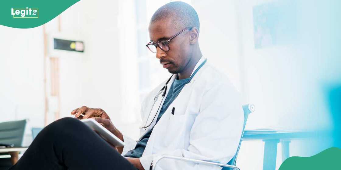 Doctor studying while sitting Doctor studying while sitting