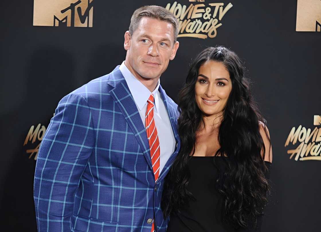 John Cena and Nikki Bella pose in the press room at the MTV Awards