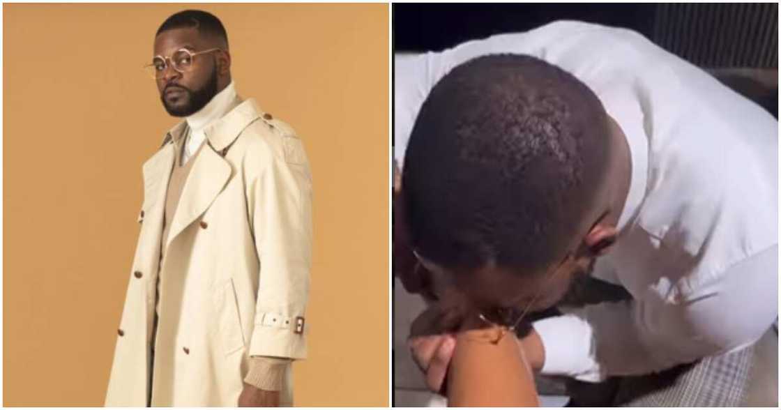 Photos of rapper Falz kissing a lady's feet Photos of rapper Falz kissing a lady's feet