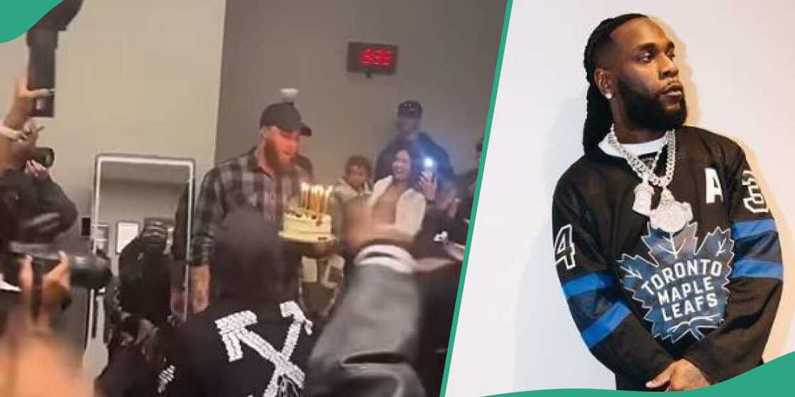 Singer Burna Boy with his bodyguard and his cake Singer Burna Boy with his bodyguard and his cake