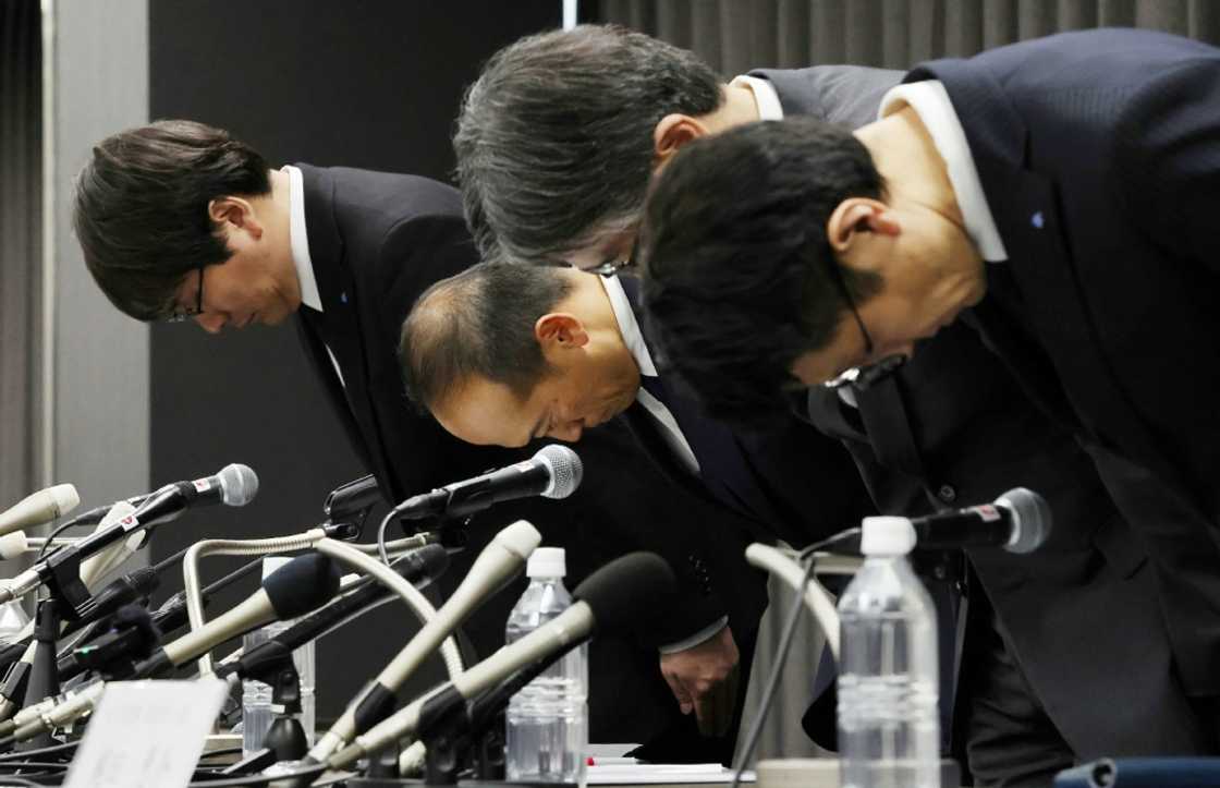 Kobayashi Pharmaceutical Co. President Akihiro Kobayashi (2nd L) and others bow their heads at a press conference in Osaka in March as the firm faces a health scare linked to its over-the-counter tablets containing red yeast rice