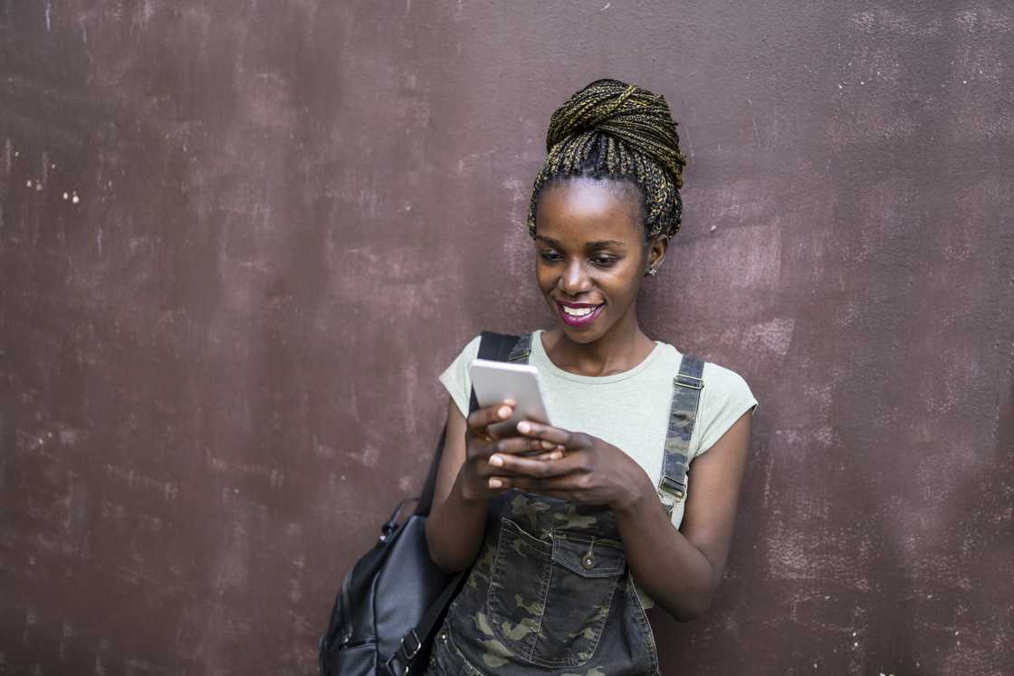 A young lady using a phone